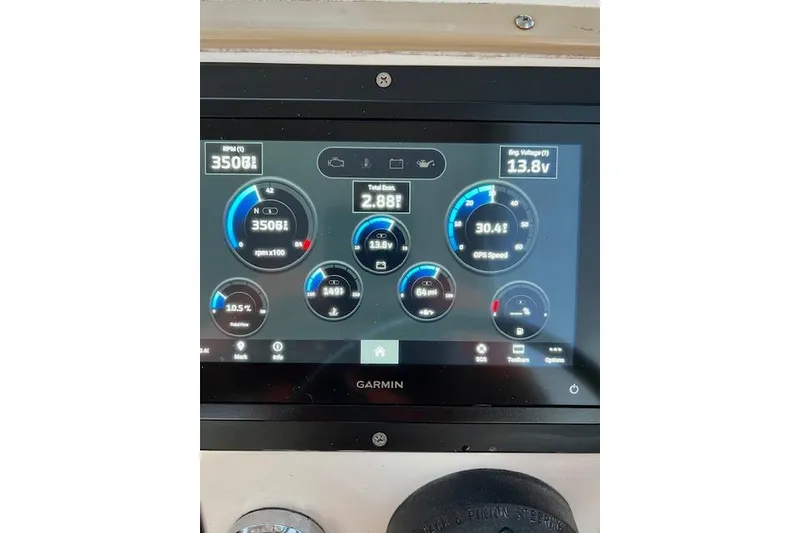 Slide: The Image of Garmin display on 1994 Albemarle Sportfish showing engine metrics and GPS speed. - 6