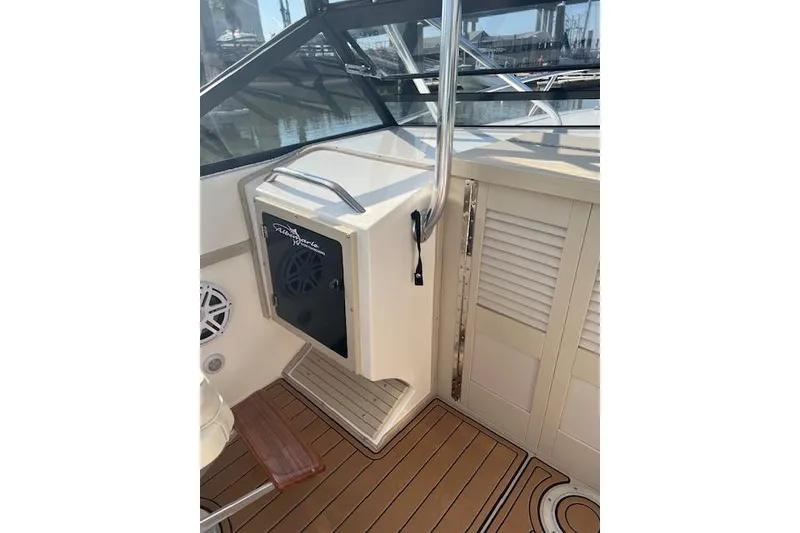 Slide: The Image of 1994 Albemarle Sportfish boat interior with wood flooring and storage compartments. - 9
