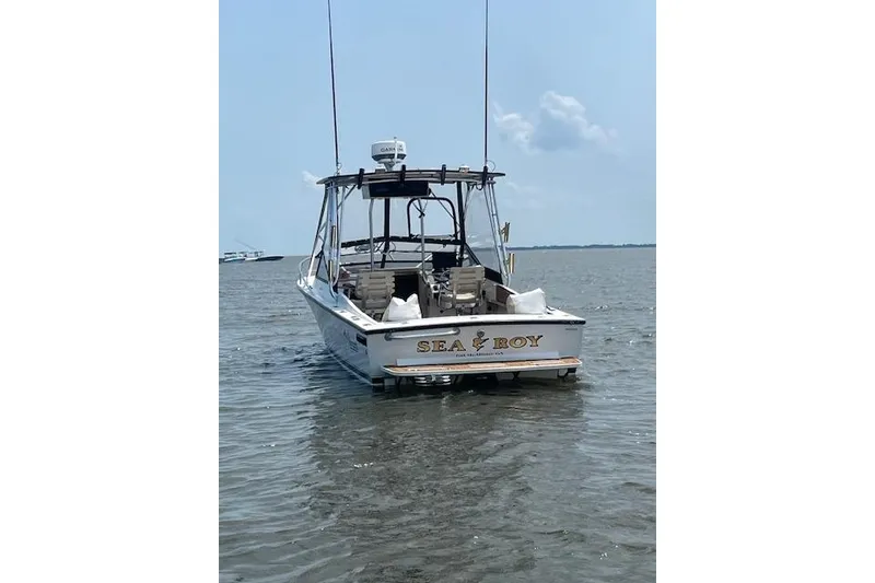 Slide: The Image of 1994 Albemarle Sportfish boat named "Sea Roy" on calm water. - 4