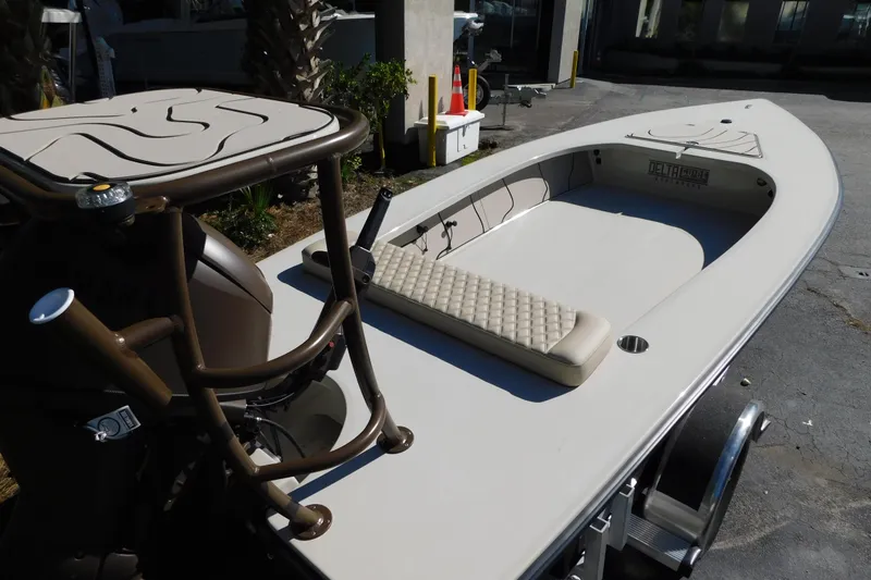 Slide: The Image of 2026 Delta Boatworks Delta D-18 Tiller with Yamaha outboard motor, docked outdoors. - 2