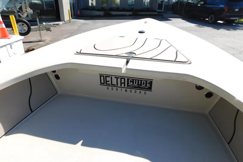Slide: The Image of 2026 Delta Boatworks Delta D18 boat on display at a dealership. - 5