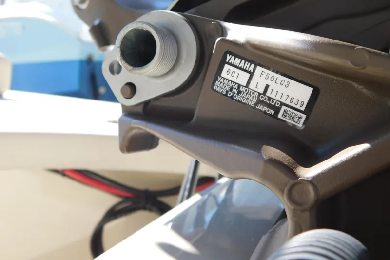 Slide: The Image of 2026 Delta D-18 Tiller boat with Yamaha outboard motor, parked on a trailer. - 28