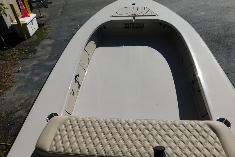 Slide: The Image of 2026 Delta Boatworks Delta D-18 Tiller, sleek design, beige interior, outdoor setting. - 3
