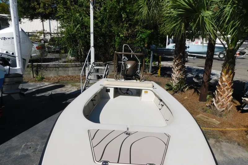 Slide: The Image of 2026 Delta Boatworks Delta D-18 Tiller interior view at a marina. - 6