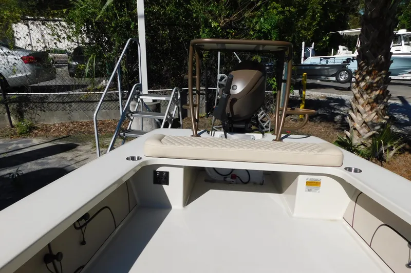 Slide: The Image of 2026 Delta Boatworks Delta D-18 Tiller in a sunny outdoor setting with palm trees. - 7