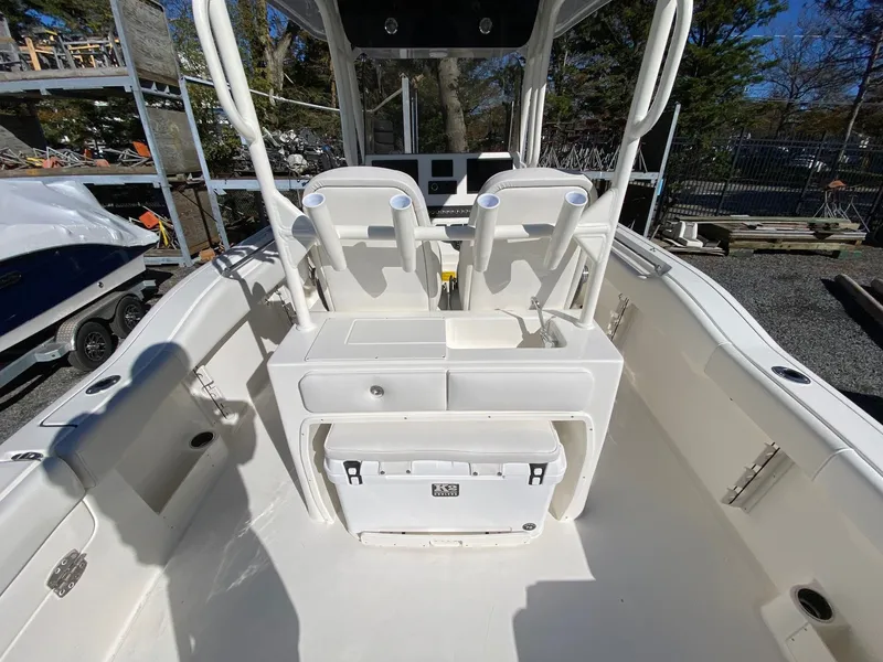 Slide: The Image of 2026 Key West 263 FS boat interior with seating and storage compartments. - 8