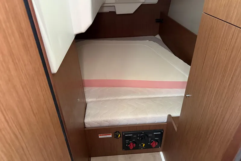 Slide: The Image of Beneteau Oceanis 35.1 2021 cabin interior with bed and control panel. - 20