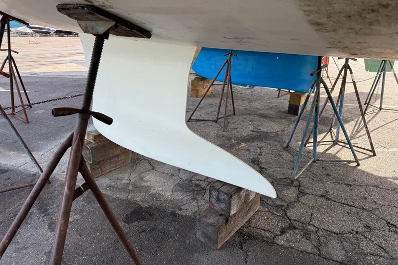 Slide: The Image of Keel of 2021 Beneteau Oceanis 35.1 sailboat on stands in a boatyard. - 23
