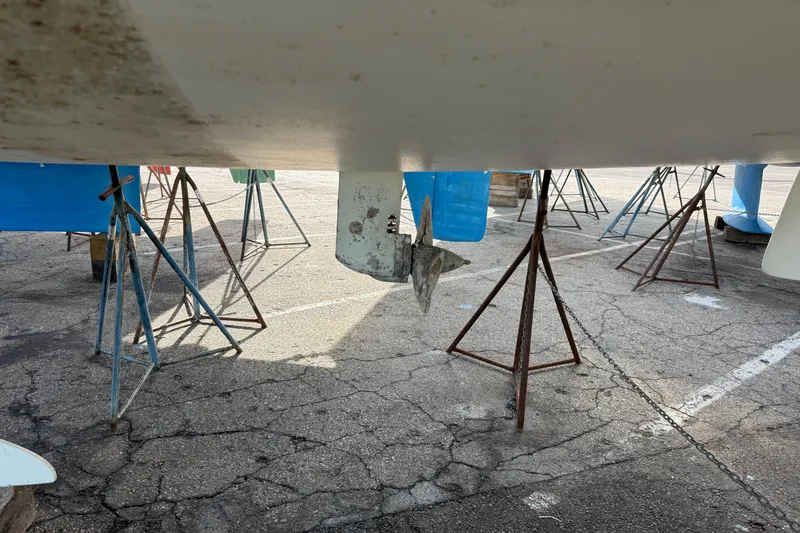 Slide: The Image of Beneteau Oceanis 35.1 sailboat hull on stands, 2021 model, in dry dock. - 24