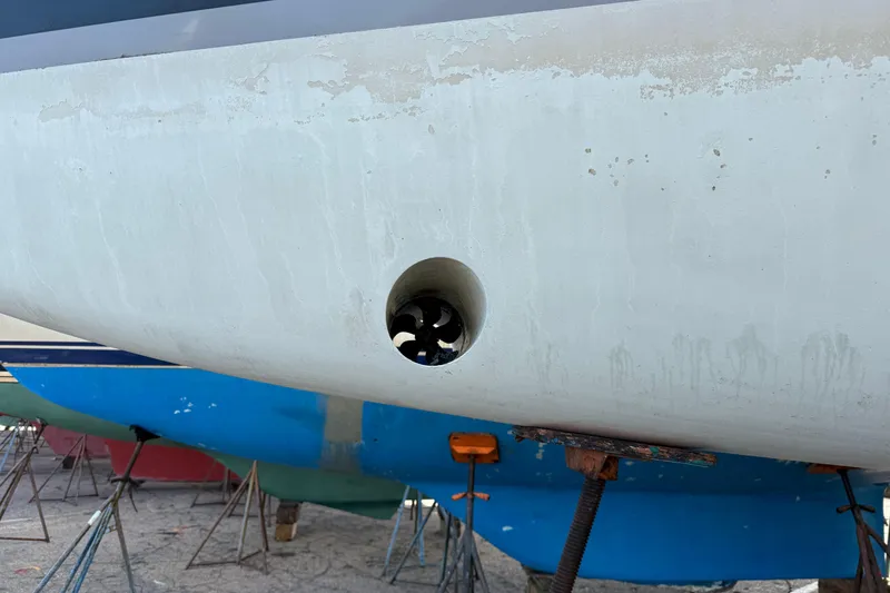 Slide: The Image of Beneteau Oceanis 35.1 (2021) hull with visible bow thruster in dry dock. - 26