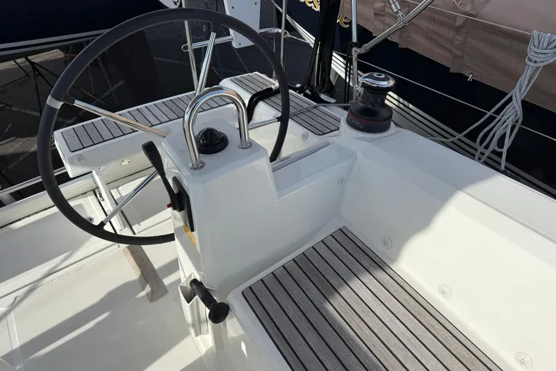 Slide: The Image of Cockpit of 2021 Beneteau Oceanis 35.1 sailboat with steering wheel and winch. - 7