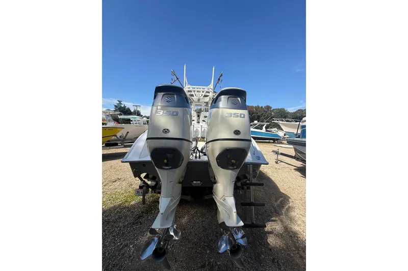 Slide: The Image of 2019 Cape Horn 32 XS boat storage compartments with open doors and organized interior. - 3