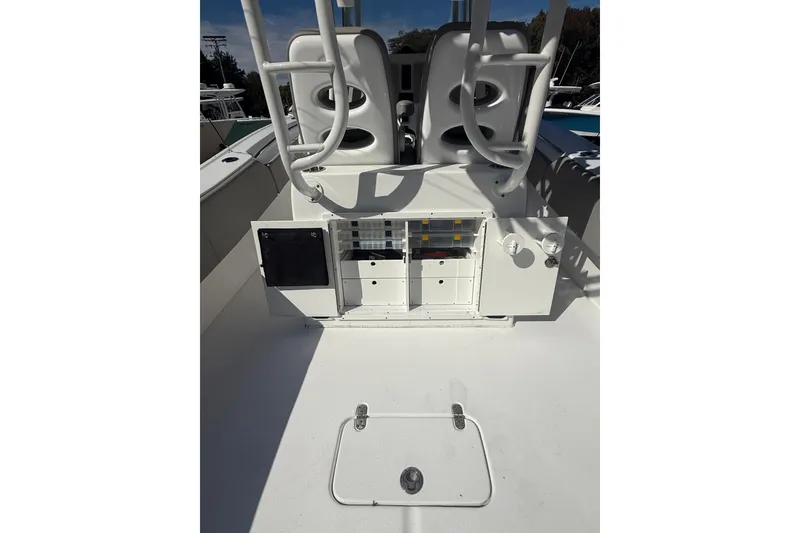 Slide: The Image of 2019 Cape Horn 32 XS boat with dual Suzuki 350 outboard engines, parked outdoors. - 7