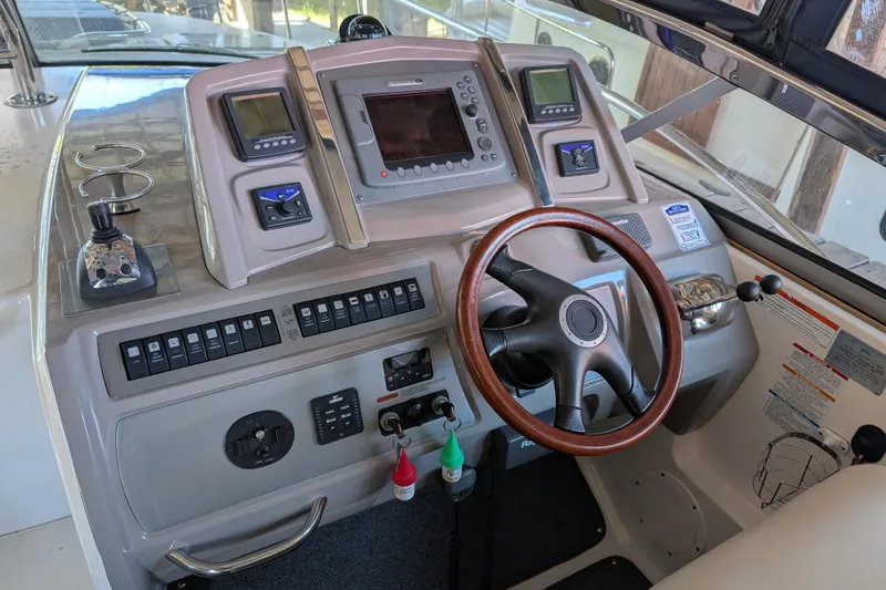 Slide: The Image of 2009 Chaparral Signature 350 boat dashboard with steering wheel and control panel. - 10