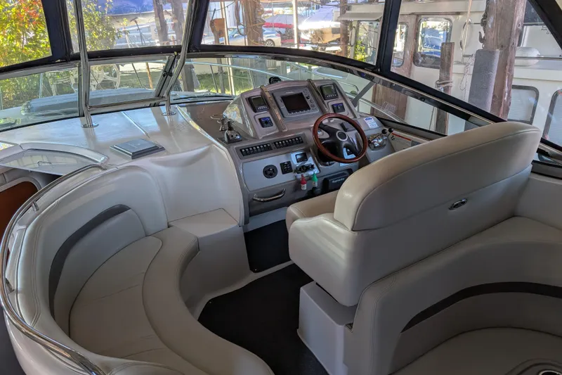 Slide: The Image of 2009 Chaparral Signature 350 boat interior with modern helm and seating area. - 13