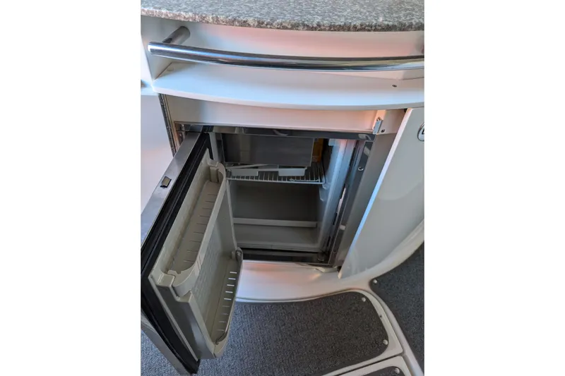 Slide: The Image of Open refrigerator in 2009 Chaparral Signature 350 boat interior. - 17