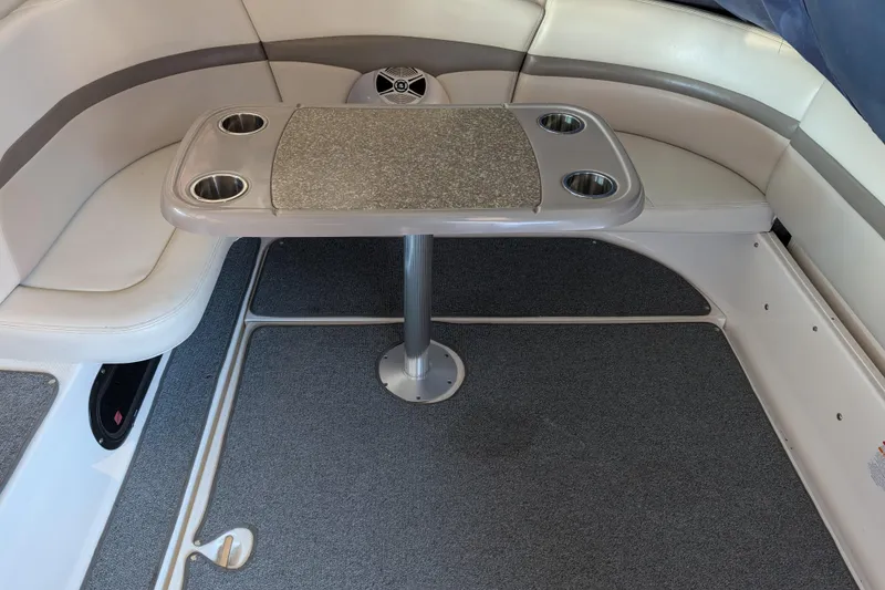 Slide: The Image of 2009 Chaparral Signature 350 boat interior with table and cushioned seating. - 18