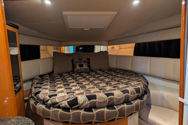 Slide: The Image of Luxurious interior cabin of 2009 Chaparral Signature 350 yacht with cozy bedding. - 19