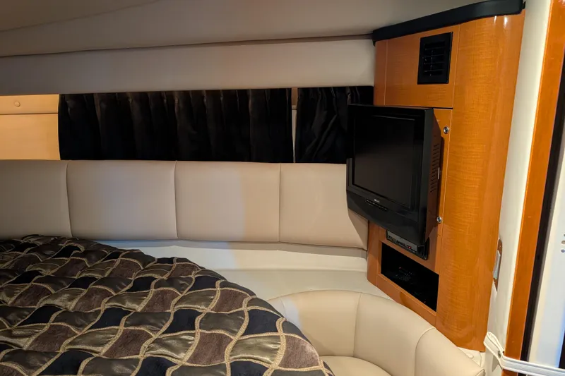 Slide: The Image of 2009 Chaparral Signature 350 cabin interior with TV and cozy seating area. - 21
