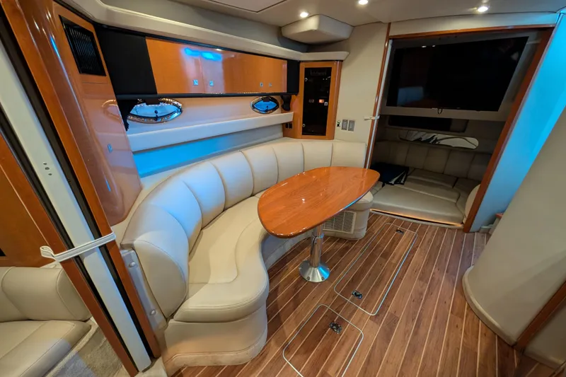 Slide: The Image of Luxurious interior of 2009 Chaparral Signature 350 yacht with elegant seating and wooden table. - 22