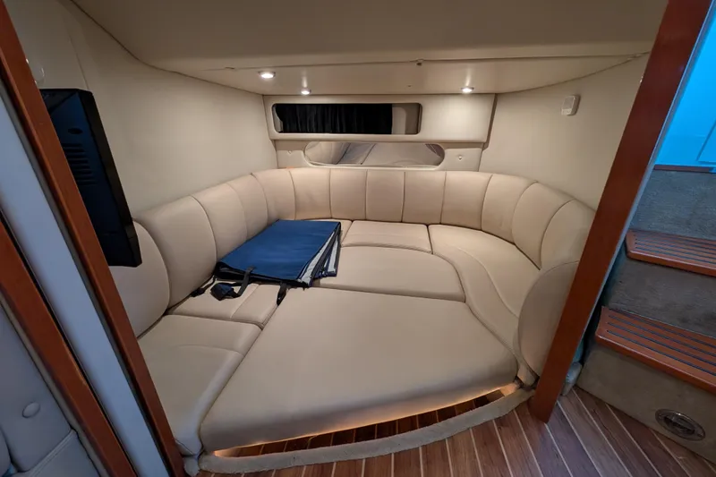 Slide: The Image of 2009 Chaparral Signature 350 interior with beige seating and wooden flooring. - 25