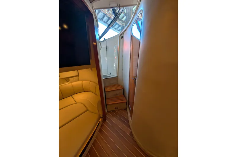 Slide: The Image of Interior of 2009 Chaparral Signature 350 yacht with seating and wooden steps. - 26