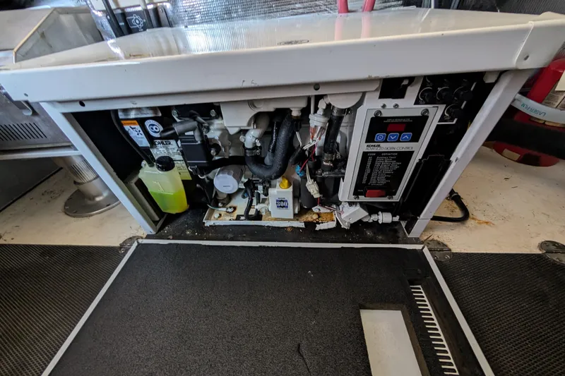 Slide: The Image of Engine compartment of a 2009 Chaparral Signature 350 boat, showing mechanical components. - 29