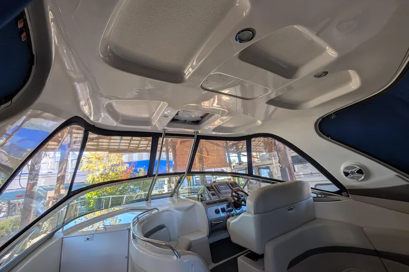 Slide: The Image of Interior of 2009 Chaparral Signature 350 boat, featuring helm and seating area. - 9