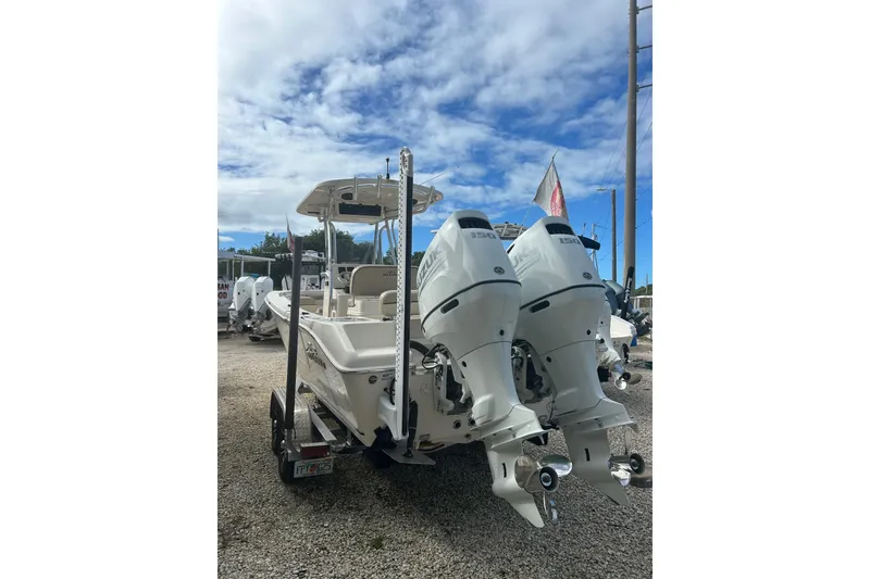 Slide: The Image of 2021 Sea Chaser Carolina Skiff with dual outboard motors on a trailer. - 3