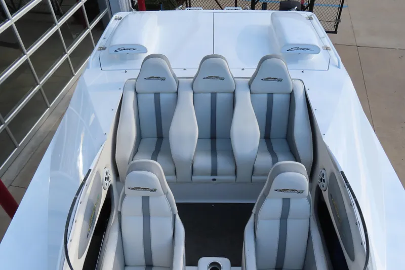 Slide: The Image of 1997 Skater 36 boat interior with white and gray seating, viewed from above. - 16