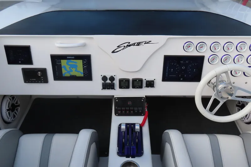 Slide: The Image of Cockpit of a 1997 Skater 36 boat with navigation and control panels. - 17