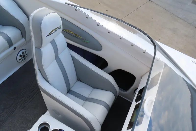 Slide: The Image of 1997 Skater 36 boat interior with white and gray seating, sleek design. - 19