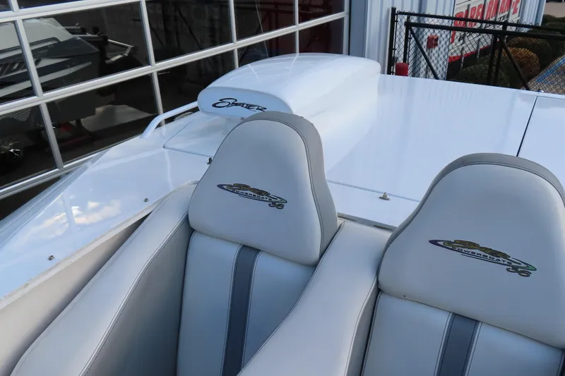 Slide: The Image of 1997 Skater 36 powerboat with white seats and logo detailing. - 22