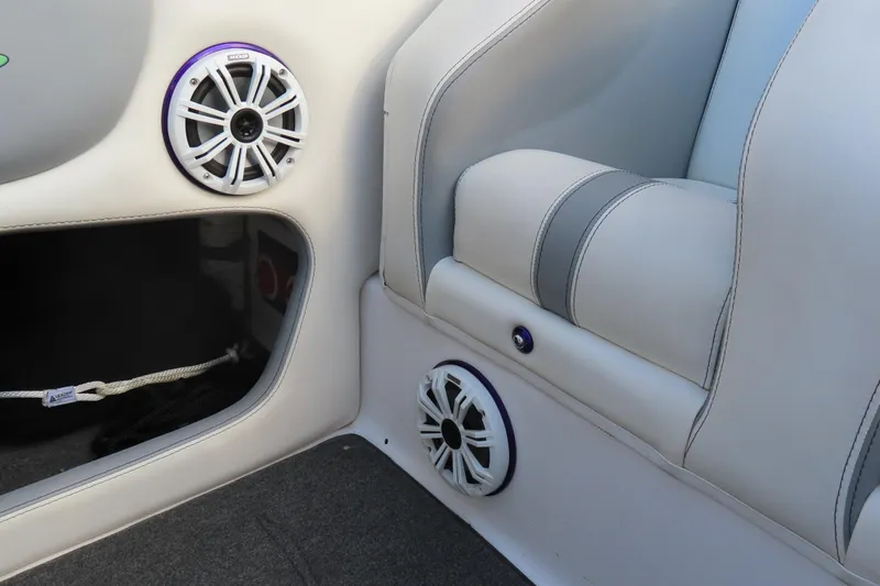 Slide: The Image of Interior of a 1997 Skater 36 boat with speakers and white seating. - 23