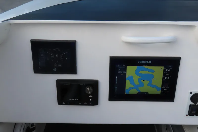 Slide: The Image of Control panel of a 1997 Skater 36 boat with navigation and audio systems. - 25