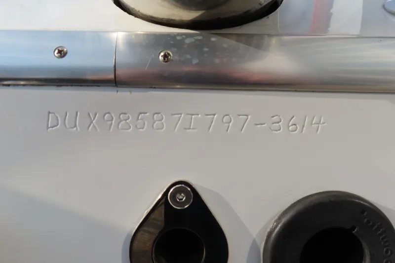 Slide: The Image of VIN number on a 1997 Skater 36 boat, engraved on a metal surface. - 7