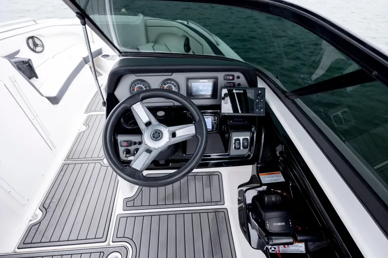 Slide: The Image of 2017 Yamaha Boats SX210 cockpit with steering wheel and control panel. - 10