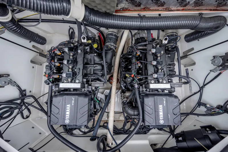 Slide: The Image of 2017 Yamaha SX210 boat engine compartment with dual Yamaha engines. - 18