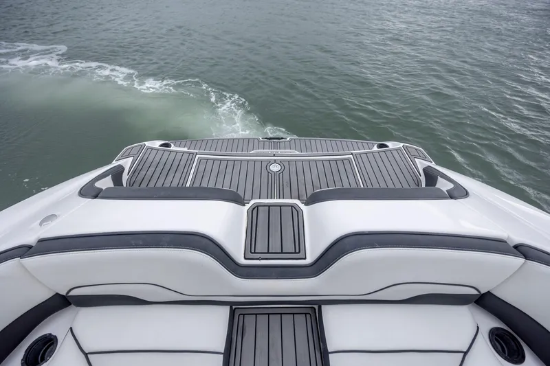 Slide: The Image of 2017 Yamaha Boats SX210 swim platform on calm water. - 4