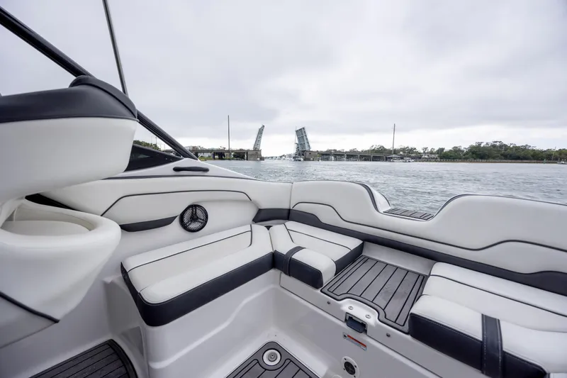 Slide: The Image of 2017 Yamaha Boats SX210 interior with open water and drawbridge view. - 6