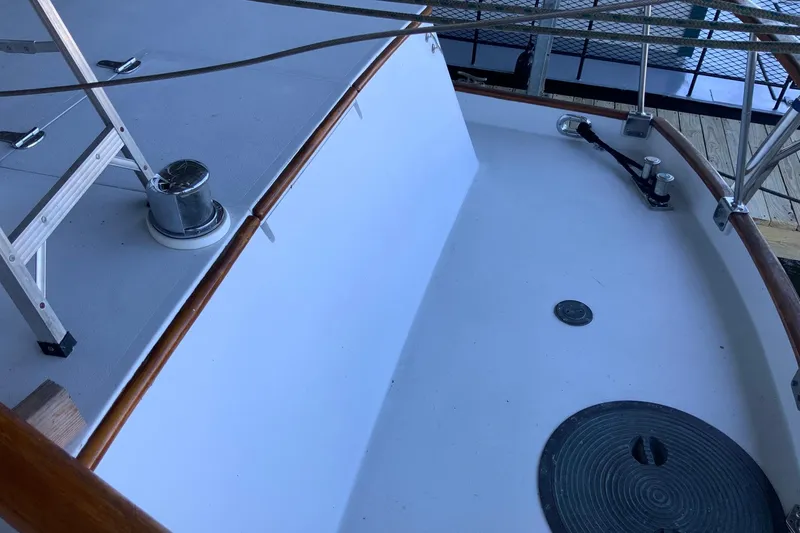 Slide: The Image of 1976 Cheoy Lee 40 LRC yacht deck with railing and winch. - 15
