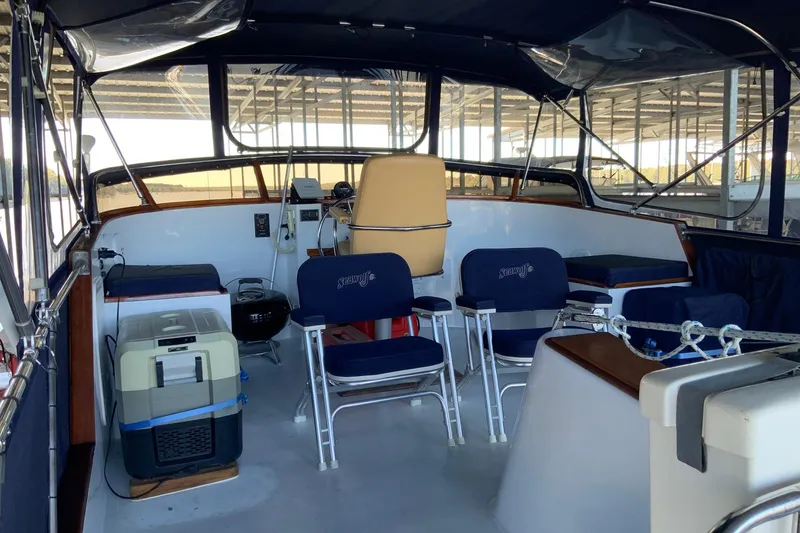 Slide: The Image of 1976 Cheoy Lee 40 LRC yacht interior with seating and navigation area. - 16