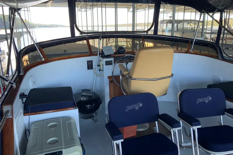 Slide: The Image of 1976 Cheoy Lee 40 LRC yacht interior with helm, seating, and navigation equipment. - 17