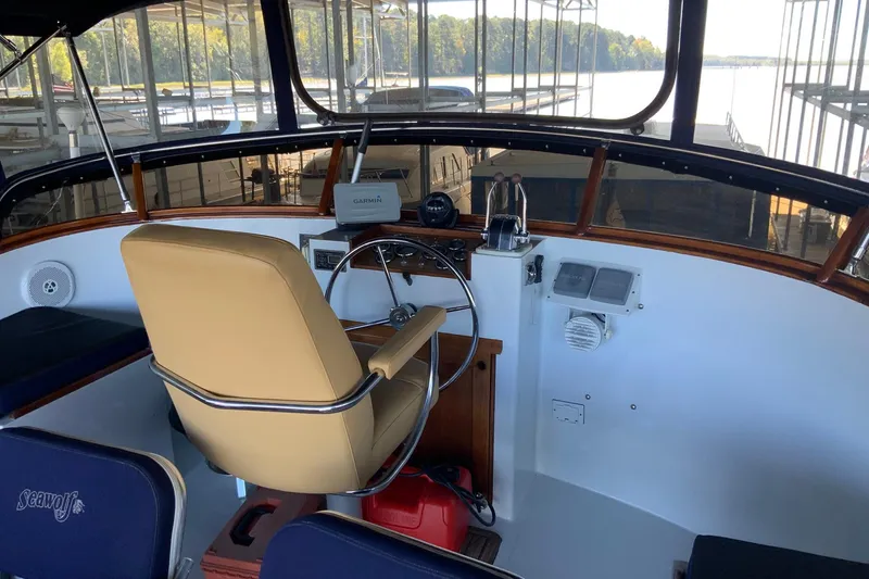 Slide: The Image of 1976 Cheoy Lee 40 LRC yacht helm with tan captain's chair and navigation equipment. - 19