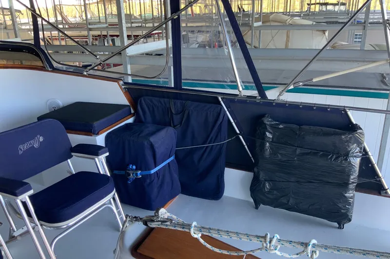 Slide: The Image of 1976 Cheoy Lee 40 LRC yacht interior with seating and covered equipment. - 20
