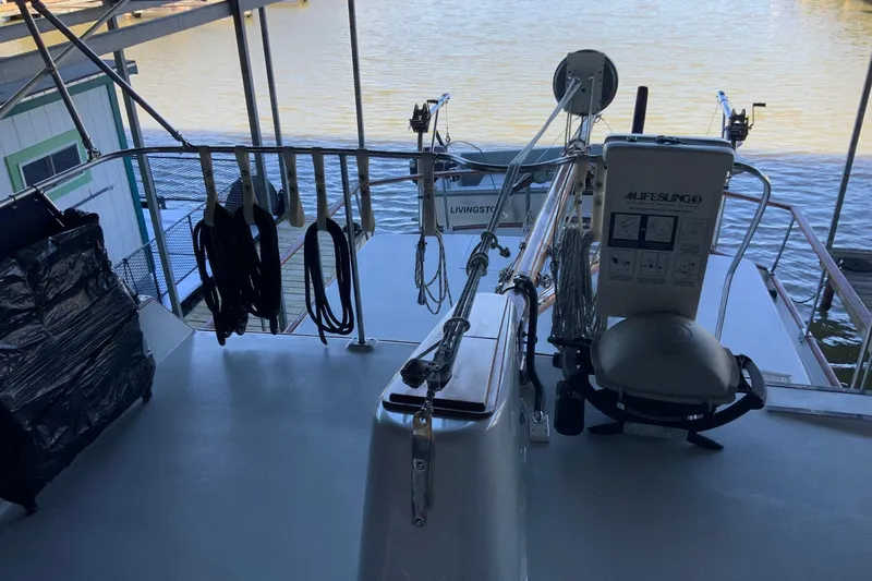 Slide: The Image of 1976 Cheoy Lee 40 LRC yacht deck with safety equipment and water view. - 21