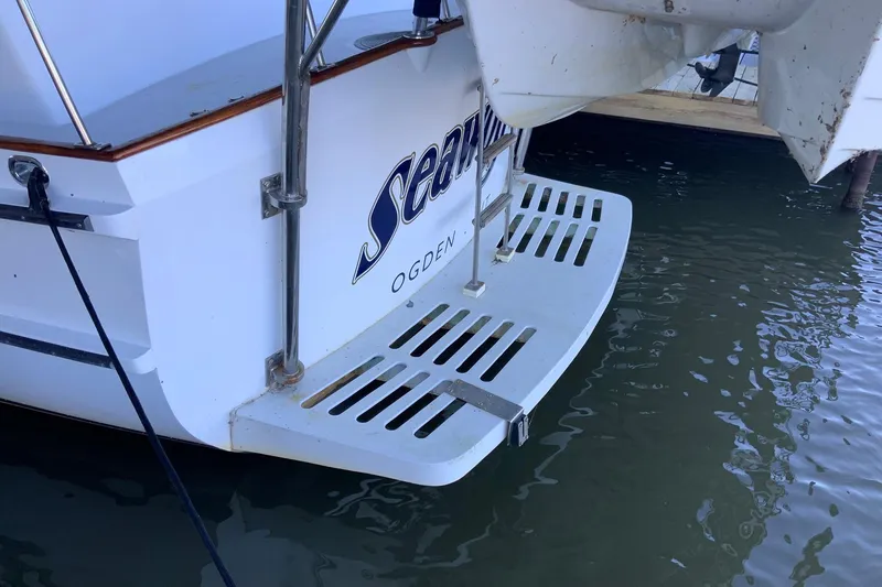 Slide: The Image of 1976 Cheoy Lee 40 LRC boat stern with swim platform and ladder. - 22