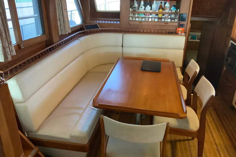 Slide: The Image of 1976 Cheoy Lee 40 LRC yacht interior with dining area and bar. - 28