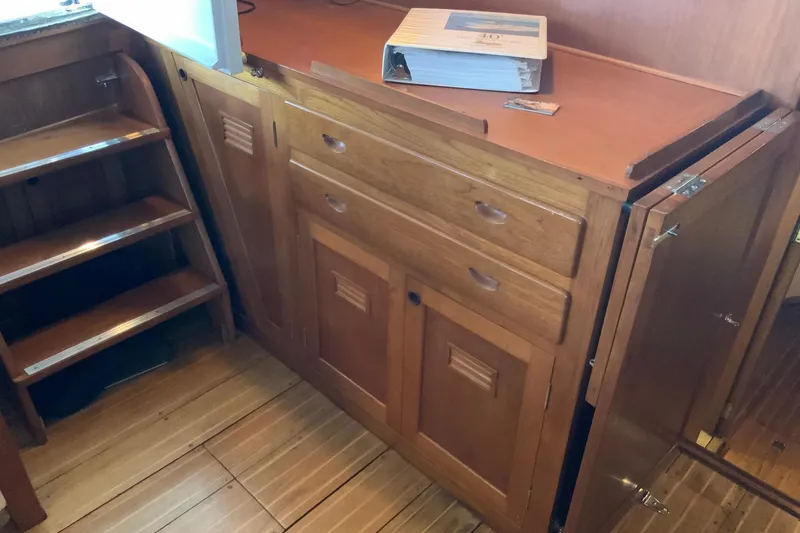 Slide: The Image of Wooden interior cabinetry and stairs on a 1976 Cheoy Lee 40 LRC yacht. - 30