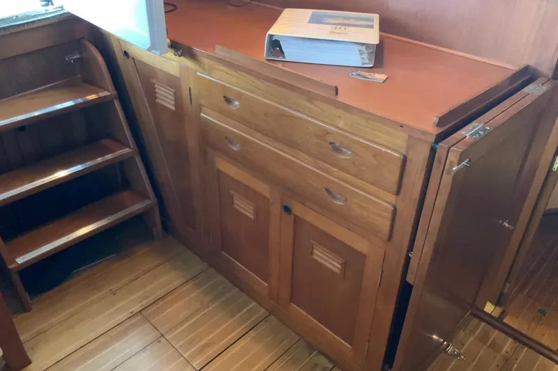 Slide: The Image of Wooden interior cabinetry and stairs on a 1976 Cheoy Lee 40 LRC yacht. - 31